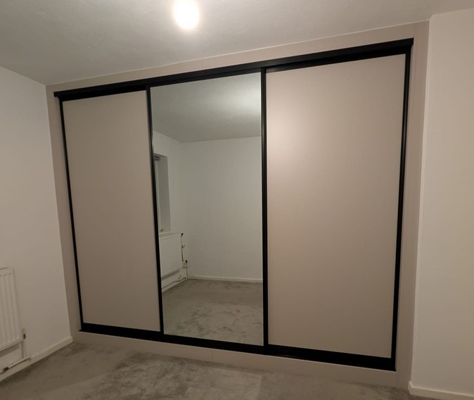 Elegant bedroom wardrobe with mirror doors